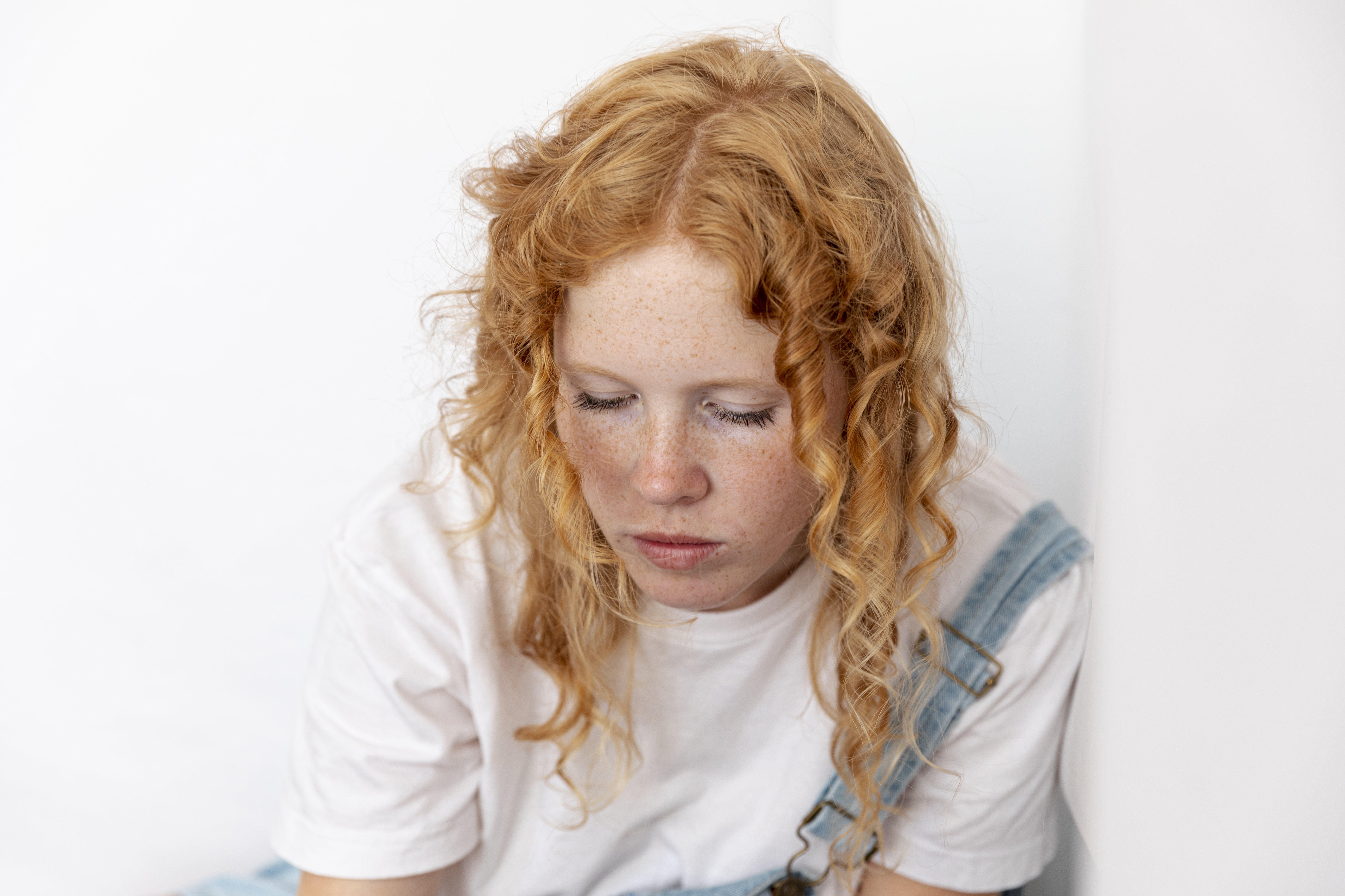 Woman With Ginger Hair Looking Down